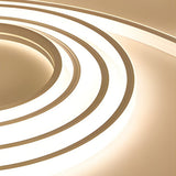 Outdoor embedded LED light strips enhancing curved architectural details with modern lighting.