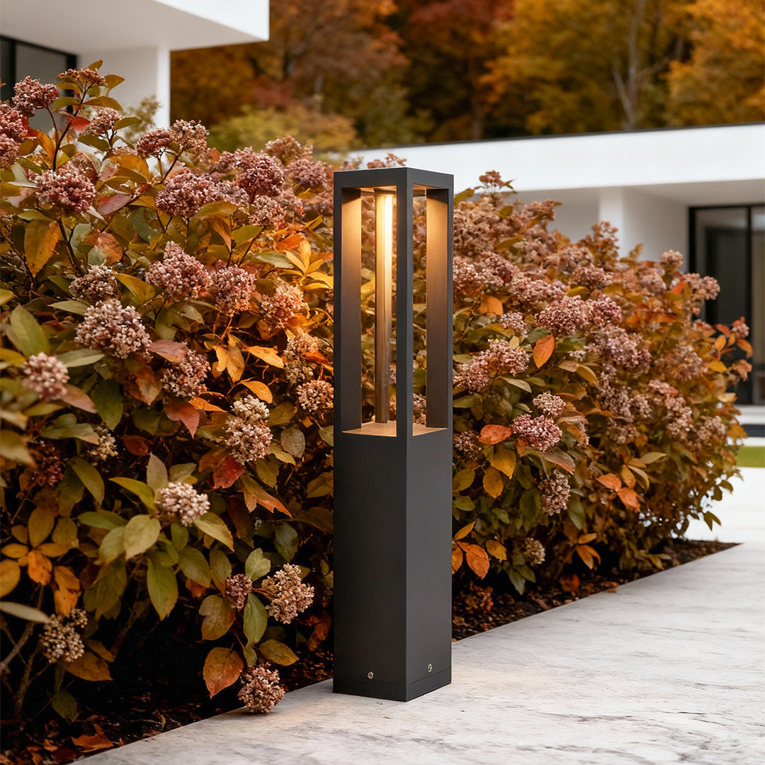 LED bollard garden light with rectangular design, mounted beside stone steps for contemporary garden illumination