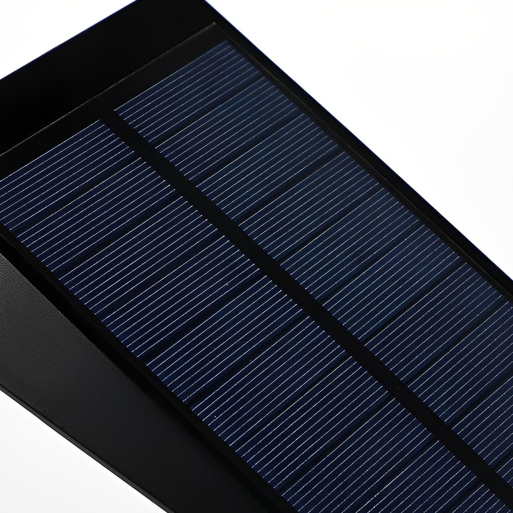 Close-up of solar panel on flood spike light, highlighting renewable energy feature for garden lighting.