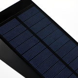 Close-up of solar panel on flood spike light, highlighting renewable energy feature for garden lighting.